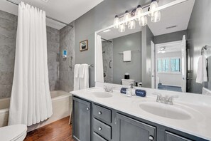 Shower, hair dryer, towels, shampoo