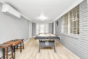 Enjoy a game of pool or foosball in this room's recreational area.