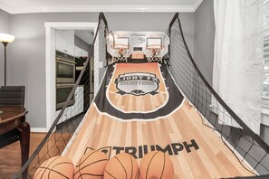 Enjoy a game of basketball on the home court, complete with a dining area nearby.