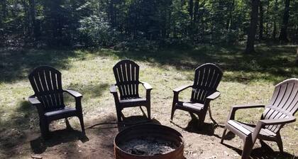 Cozy Log Cabin on 25 acres with Hot Tub between Ludington and Baldwin w/ AC WiFi