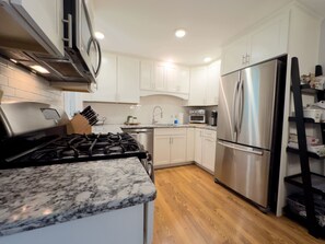 Fridge, microwave, oven, stovetop - 🏔️ Serene 4BR Retreat w/ Outdoor Dining, Gym, Workstation & Modern Comforts (Kirkland)