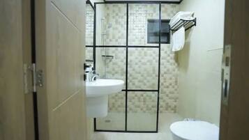 Shower, hair dryer, towels, soap