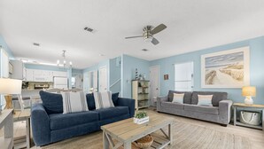 A living room with two sofas, a coffee table, and a rug. - 2 Bikes~ Newly renovated Pool~Bike to Seaside (Santa Rosa Beach)