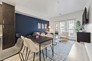 Deluxe Apartment, 1 Bedroom, Non Smoking, Balcony | Living area | 55-inch Smart TV with digital channels - ROVE LIVING/KB - Midtown205 (Charlotte)
