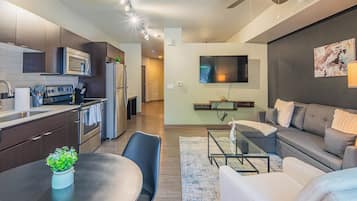 Exclusive Apartment, 1 Bedroom, Non Smoking, Kitchen | Living area | 55-inch Smart TV with digital channels