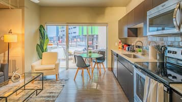 Exclusive Apartment, 1 Bedroom, Non Smoking, Kitchen | Living area | 55-inch Smart TV with digital channels