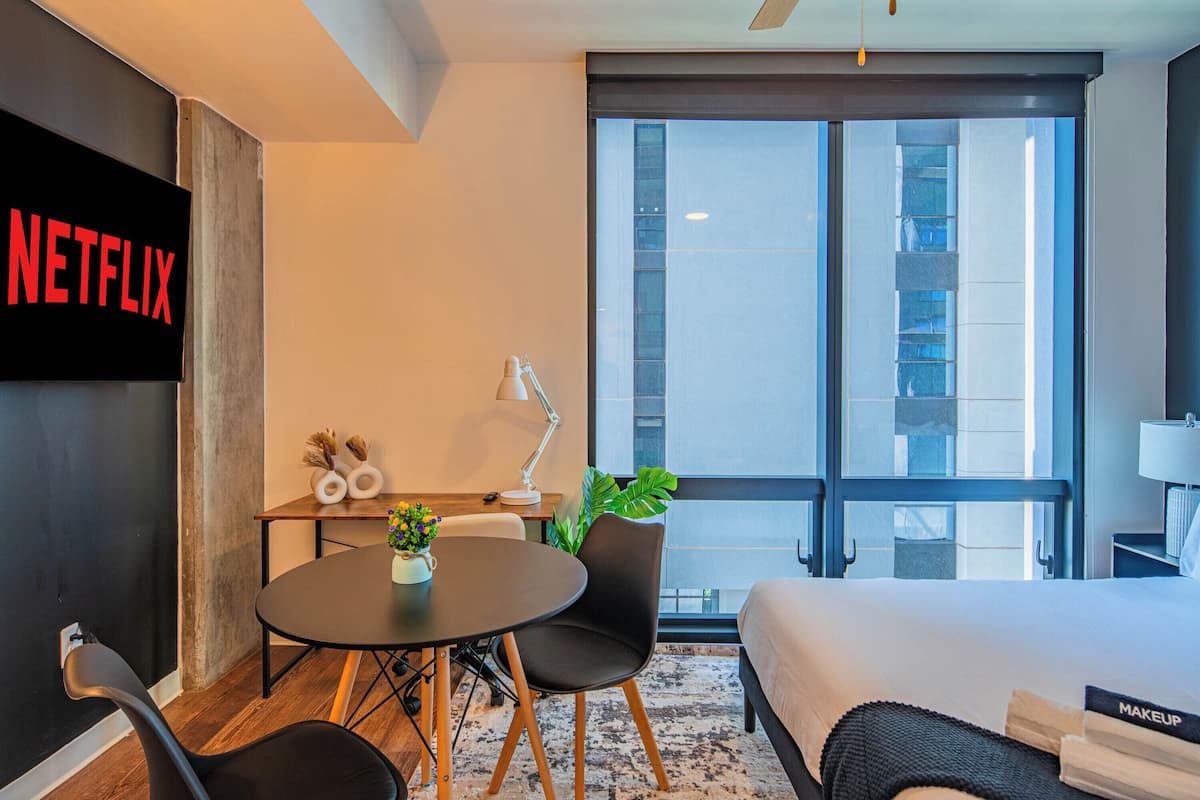 Luxury Studio, 1 Queen Bed, Non Smoking, Kitchen | 1 bedroom, desk, laptop workspace, iron/ironing board