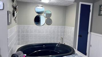Jetted bath, hair dryer, towels, soap