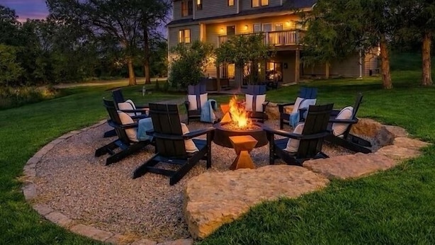 A house with a fire pit surrounded by outdoor seating. - Galena Getaway: Sauna, Hot Tub, Fire Pit, and Arcade Fun Awaits! (Galena)