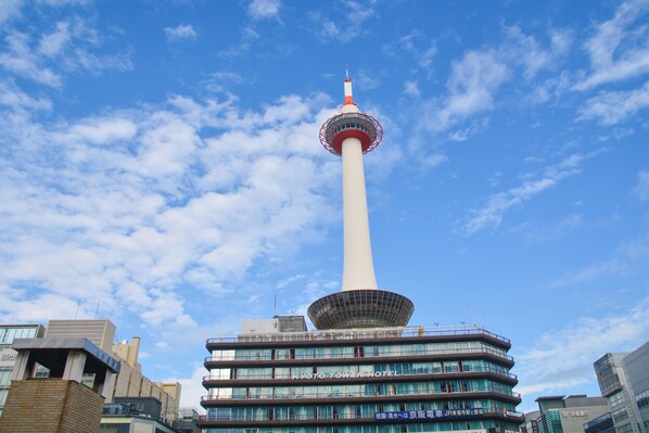 A hotel with a prominent tower structure, multiple floors, and a modern design.