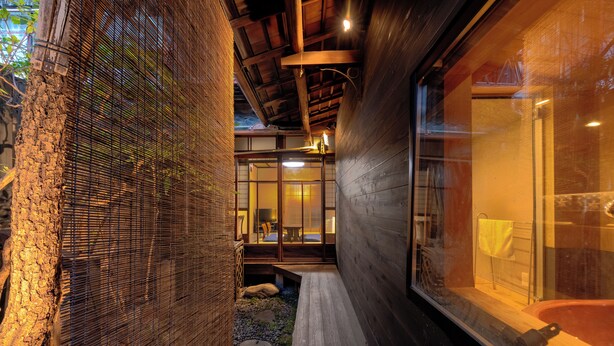 A traditional Japanese-style interior with tatami flooring, wooden beams, and sliding doors. -  Nijo-Ouan (Kyoto)
