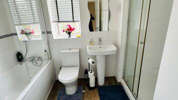 Shower, hair dryer, towels, shampoo