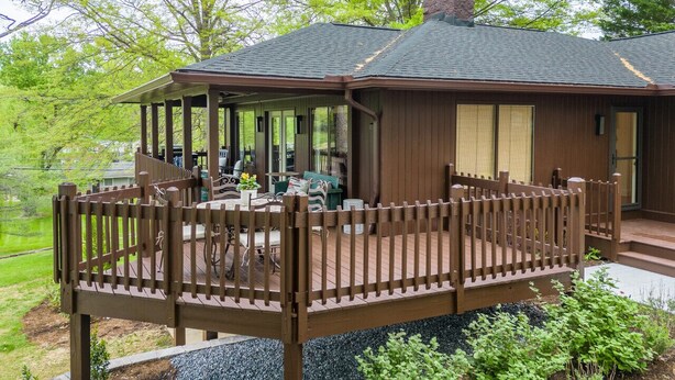 A wooden cabin with a deck, a chimney, and a covered porch. - Tranquil home near W&L, VMI (Lexington)
