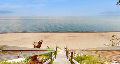Serene Lake Michigan home with private beach access, wooded land, near town.