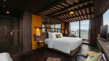 Suite estudio ejecutiva, balcón, vista a la ciudad | Ropa de cama de alta calidad y minibar