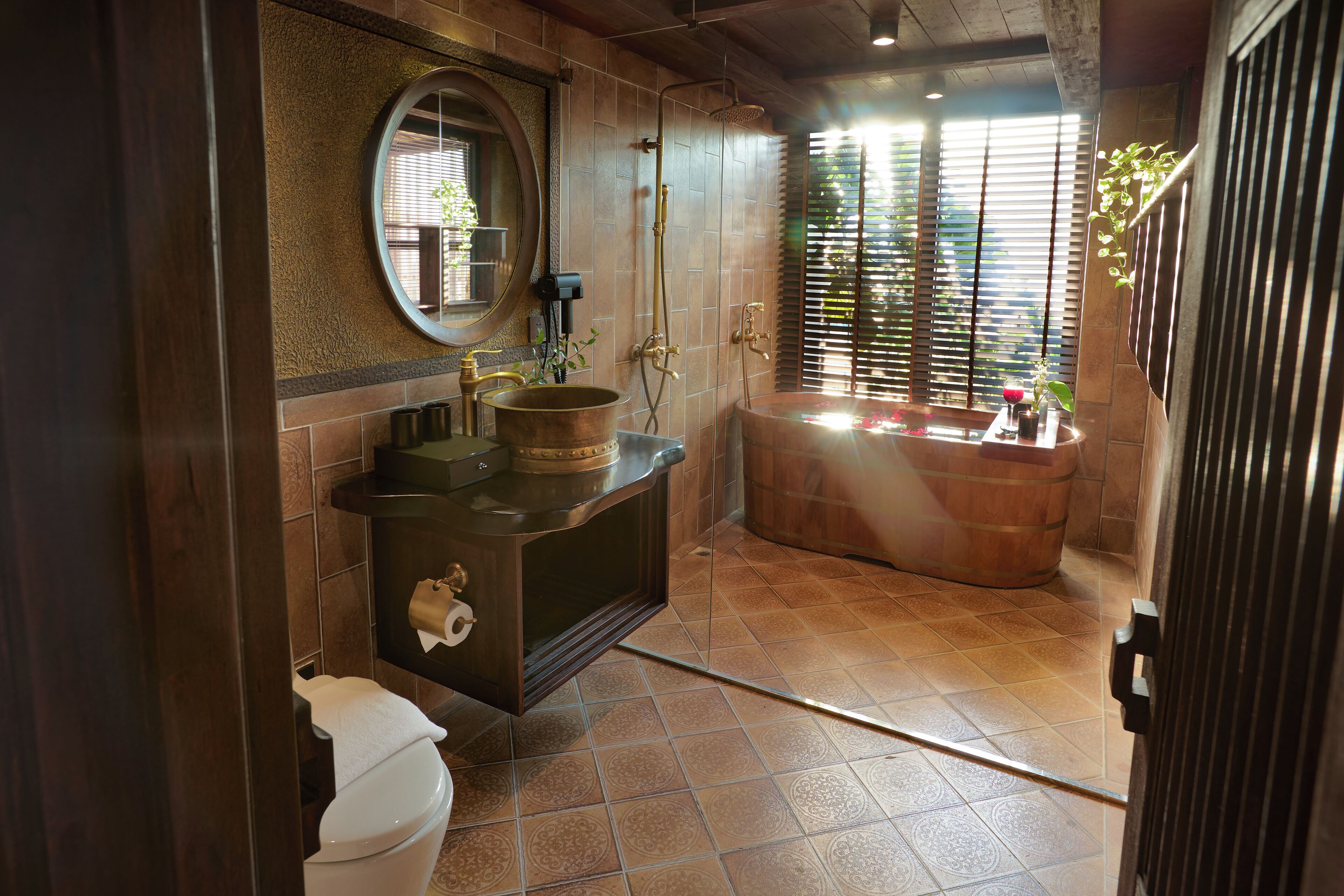 A bathroom with a bathtub, a sink, and a toilet.
