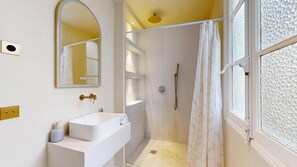 Shower, hair dryer, towels, shampoo