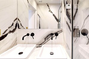 Shower, hair dryer, towels, soap