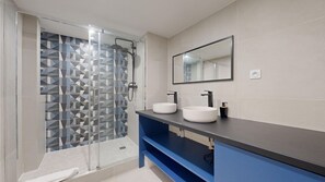 Shower, hair dryer, towels, soap
