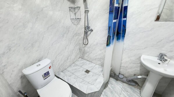 Economy Shared Dormitory, Men only, Non Smoking, Courtyard View | Bathroom | Shower, free toiletries, hair dryer, slippers
