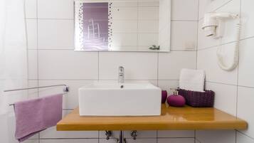 Hair dryer, towels, soap, toilet paper