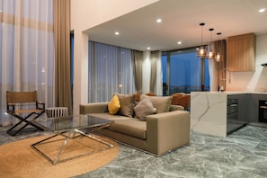 Three-Bedroom Apartment with Ocean View | Living area | 45-inch LED TV with cable channels, Netflix, streaming services - Elite Atoll Serviced Apartments (Rawai)
