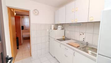 Fridge, stovetop, dining tables