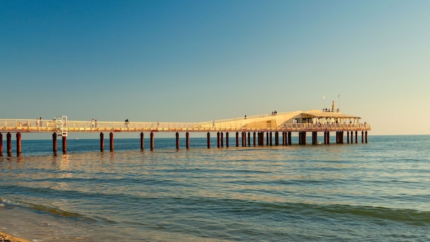 A pier extending into the water with a building on it. - Villa Vittoriano - Surrounded By Nature (Camaiore)