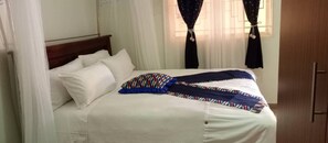 In-room safe, individually decorated, individually furnished, desk - Hotel Judith (Gulu)