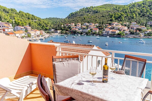 Enjoy a romantic dinner for two on this picturesque hillside terrace overlooking the bay.