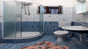 A bathroom with a glass-enclosed shower, a toilet, and a sink. - Guest House Cesic - Double Room No8 (Dubrovnik)