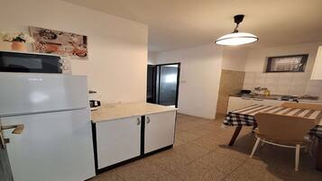 Fridge, oven, stovetop, dining tables