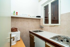 Fridge, stovetop, dining tables