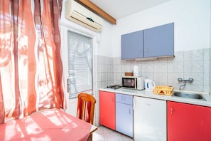 Fridge, stovetop, dining tables