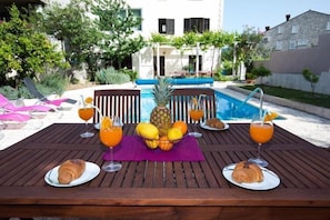 Enjoy a leisurely breakfast amidst the tranquil surroundings, with a delicious spread of pastries and fresh fruit.