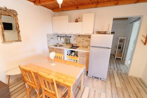 Fridge, stovetop, dining tables