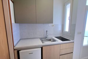 Fridge, stovetop, dining tables