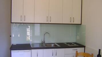 Fridge, oven, stovetop, dining tables