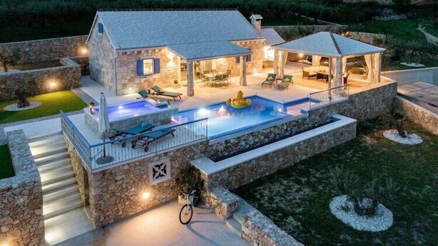 A stone house with a swimming pool, outdoor seating, and a covered patio area. - Villa Blue Sky - Three Bedroom Villa with Pool (Bol)