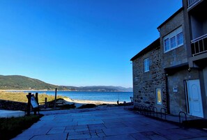 A stone building with a view of the sea.