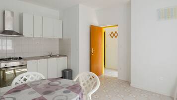 Fridge, oven, stovetop, dining table