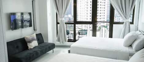 Suite estudio Confort, balcón, vistas a la ciudad | 1 dormitorio, tabla de planchar con plancha, wifi gratis