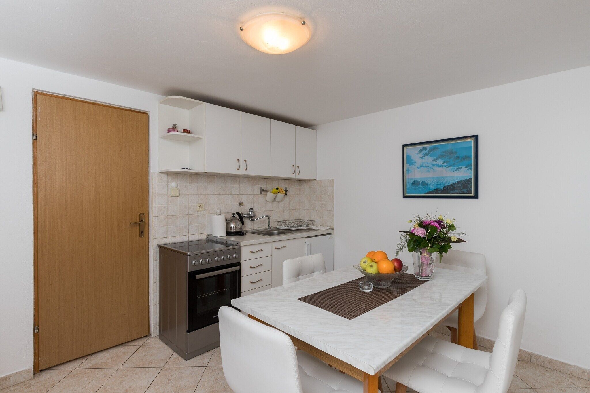 Fridge, oven, stovetop, dining tables