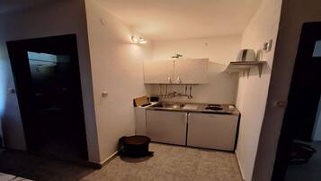 Fridge, stovetop, dining tables