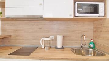 Fridge, microwave, stovetop, coffee/tea maker