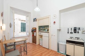 Fridge, microwave, stovetop, dining tables