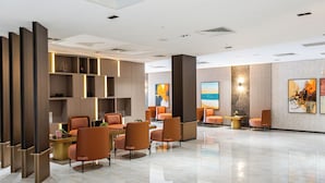 A spacious lobby with modern seating, a central table, and artwork on the walls. - Byon Hotel Şile (Sile)