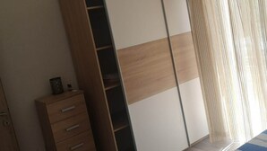 A room with a wardrobe, a small cabinet, and a window with sheer curtains. - Apartments Kalajzic-  One Bedroom Apartment with Terrace(A3) (ST) (Pucisca)
