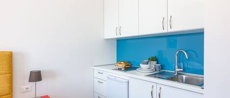 Fridge, stovetop, toaster, dining tables