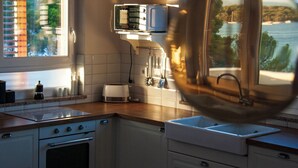 A kitchen with a window, a toaster, and a sink. - Hedonistic villa and a unique view from the terrace that changes 24 hours a day (Jelsa)